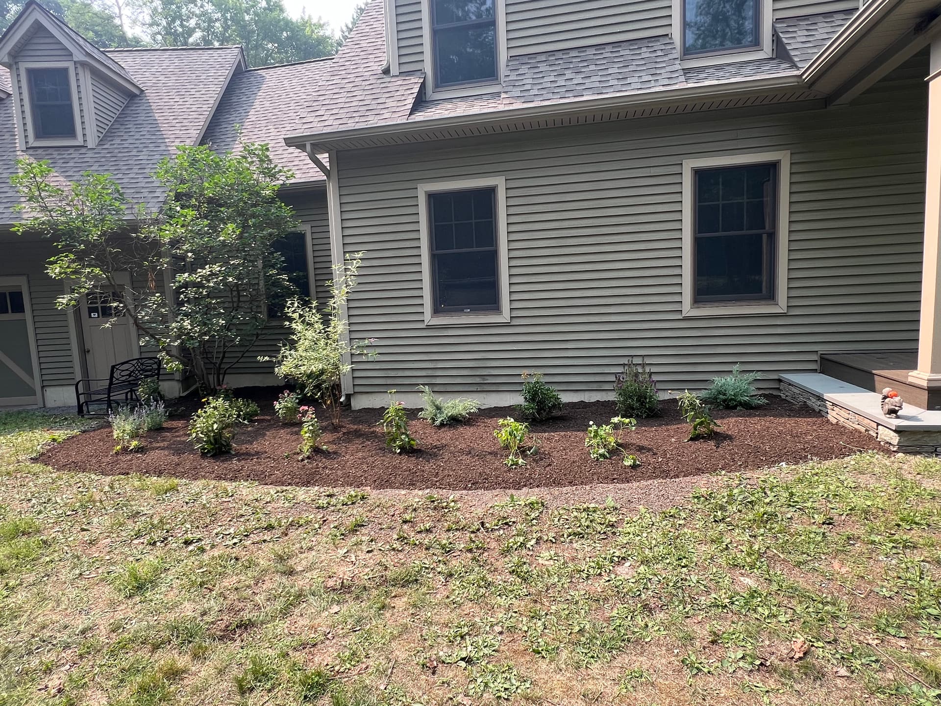 Fresh Mulch Beds, Stone Stoops, and Paver Patios Done Right image